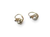 a pair of gold earrings with pearls and diamonds on a white background