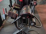 a gym area with a row of machines in it