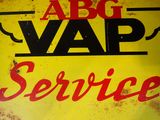 yellow and red sign with the words abcg vap service on it