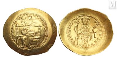 a close up of a gold coin with a picture of a man on it