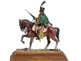 the figurine is of a man on a horse with a sword
