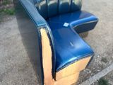 a blue couch and a blue chair sitting on the sidewalk