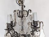 a chandelier hanging from the ceiling in a room