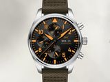 an image of a watch with a brown strap and a black dial
