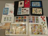a lot of stamps and stamps on a table