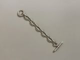 a close up of a silver chain with a hook on it