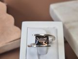 a ring that is sitting in a box on a table