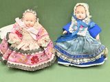 two porcelain dolls of a woman and a baby