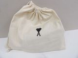 a bag with a black heart on it sitting on a table