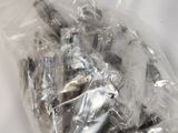 a plastic bag with a bunch of nuts inside of it