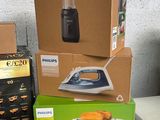 several boxes of household appliances are stacked on a table