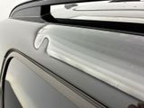 a close up of a person ' s hand on the hood of a car