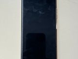 an image of a cell phone sitting on top of a white table