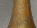 a brass bell that is sitting on a table