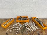 many different types of spoons and spoons on the table