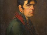 portrait of a man in a green jacket and red scarf