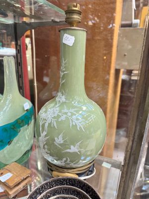 two vases on display in a glass case