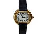 a close up of a wrist watch with roman numerals on it