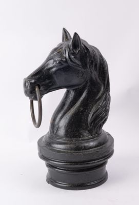 an image of a statue of a horse with a ring in it ' s mouth