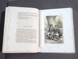 an open book with a picture of a man and a woman sitting on a bench
