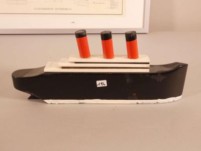 a black and white model of a boat on a table