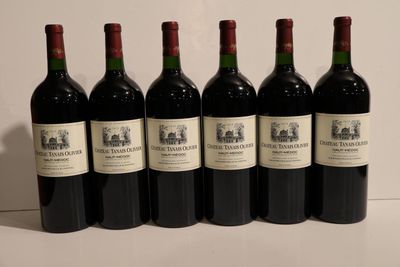 six bottles of wine are lined up on a table