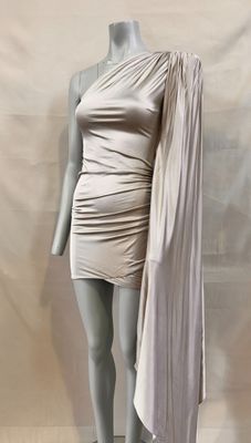 the mannequin is wearing a dress with a cape over it