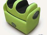 a green recliner that is sitting on a white surface