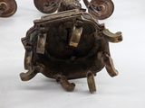 a bronze statue of a man riding on a horse