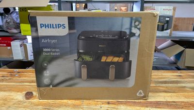 une boîte sur laquelle figure l'image d'une friteuse à air chaud