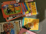 many children ' s books on the table together