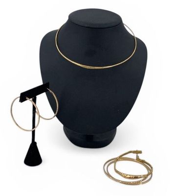 a close up of a necklace on a mannequin with other jewelry