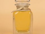 a small bottle of perfume sitting on a table