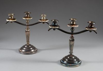 pair of antique silver plated candelabs with candles