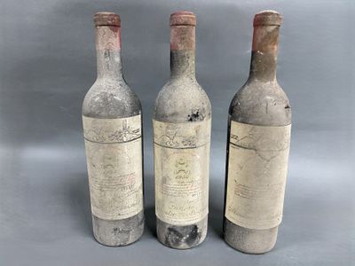 three bottles of wine sitting next to each other on a table