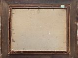 an old picture frame with a piece of paper taped to it