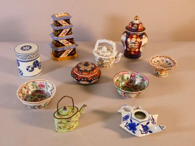 many different types of teapots and bowls on the table