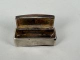 a silver box that is sitting on a table