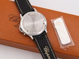 an image of a watch sitting on top of a box next to a piece of paper