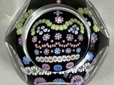 a glass bowl with a design on it sitting on a table