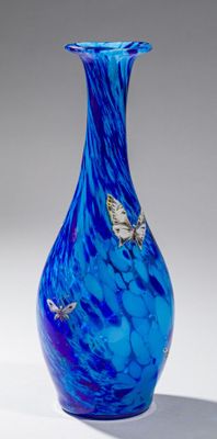 a blue vase with butterflies on it on a white surface