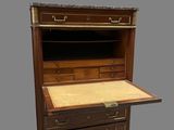 an old wooden desk with drawers and a drawer on top of it