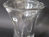 a glass vase that is sitting on a table
