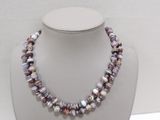a close up of a necklace on a mannequin display
