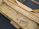 a small wooden boat that is sitting on top of a table