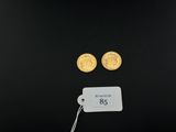 two gold coins with a price tag and a price tag attached to them