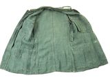 an image of a green skirt with pockets on a white background