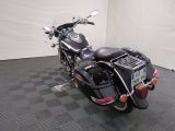 a motorcycle that is parked in a room with a checkered floor