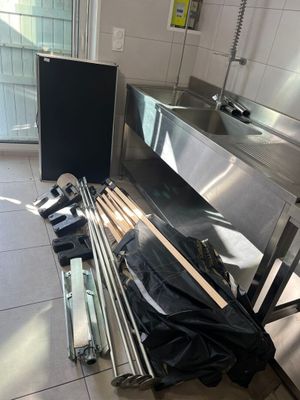 an image of a kitchen with a sink and a lot of tools