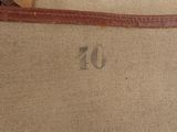 a brown suitcase with a brown handle and a brown strap